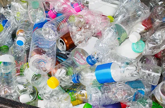 packaging waste including plastic bottles and aluminium cans for recycling