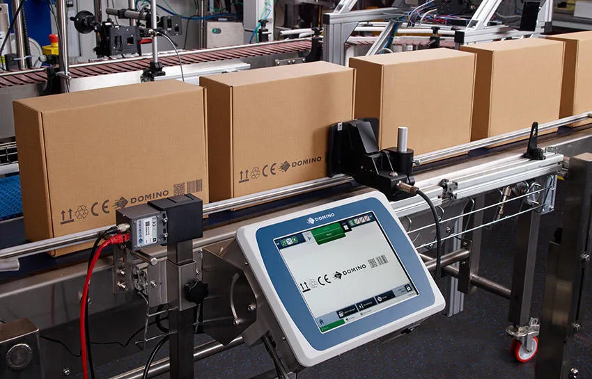 Gx-Series PRO printing onto brown boxes on a production line
