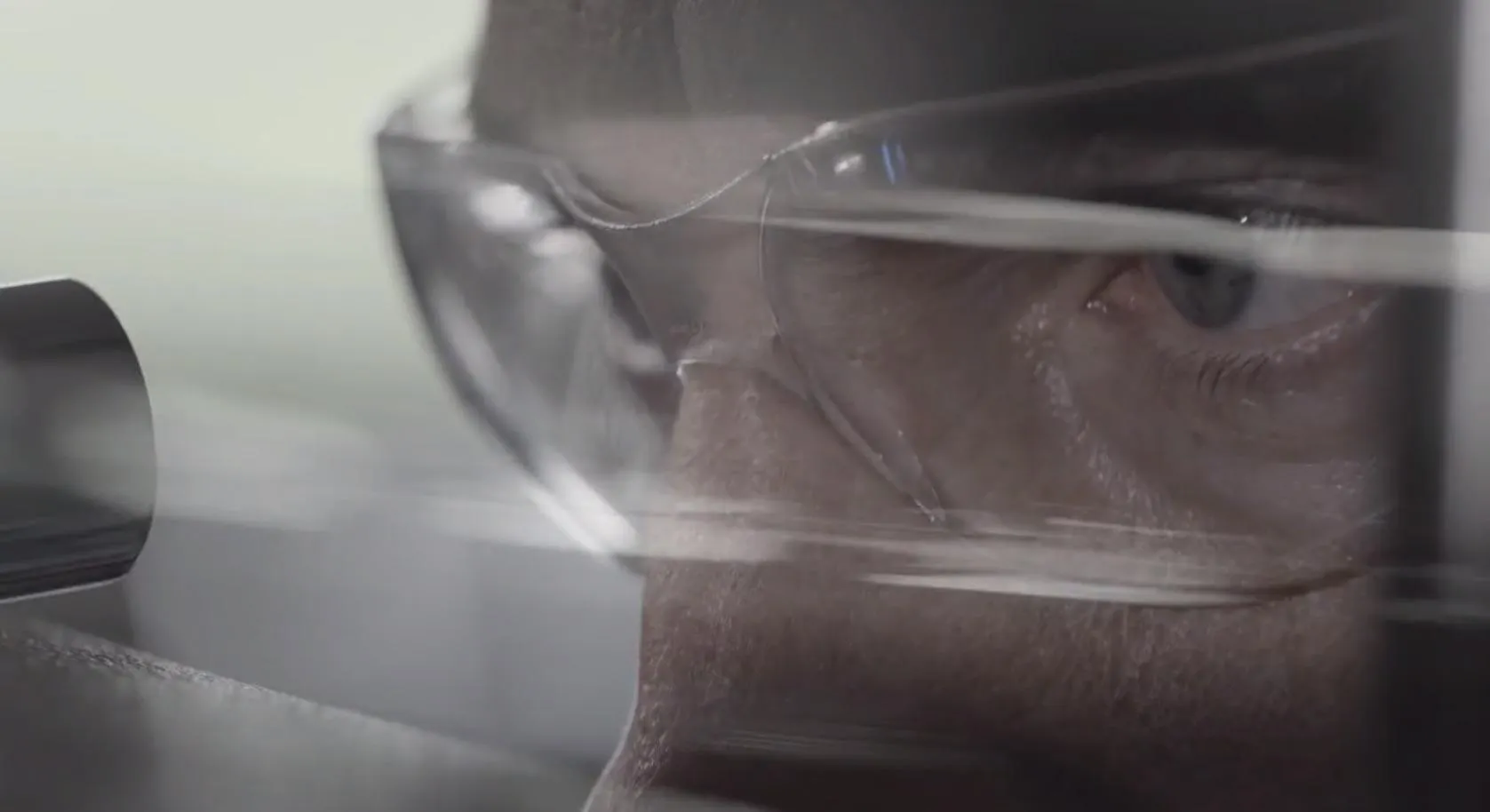 close up from bridge of nose to forehead of a persons face wearing eye protection spectacles 